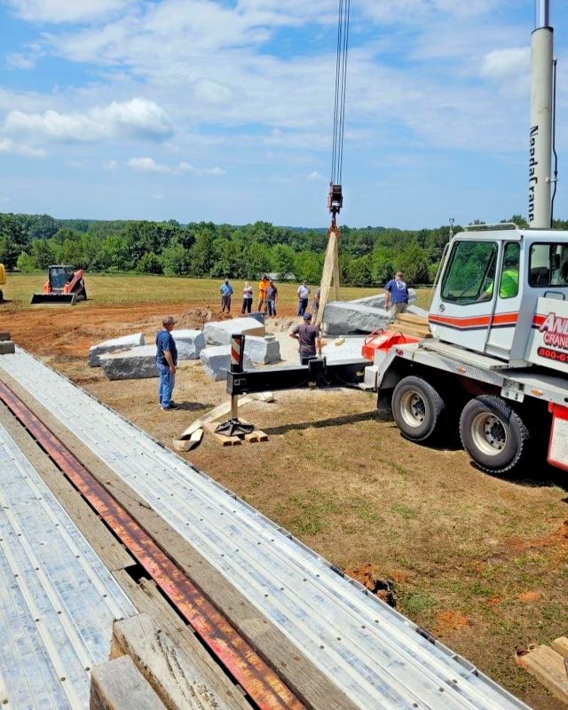 Beginning to load the Georgia Guidestones onto our flatbed trailer